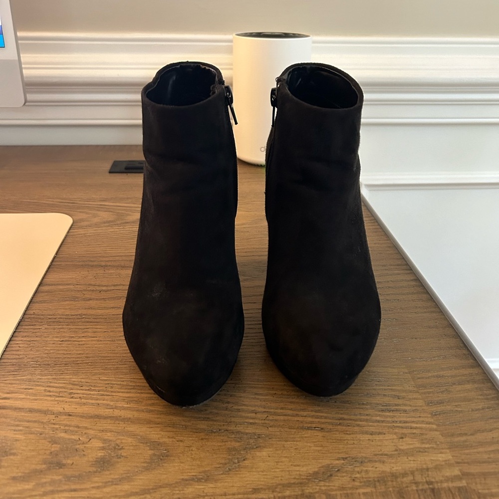 Heeled black booties